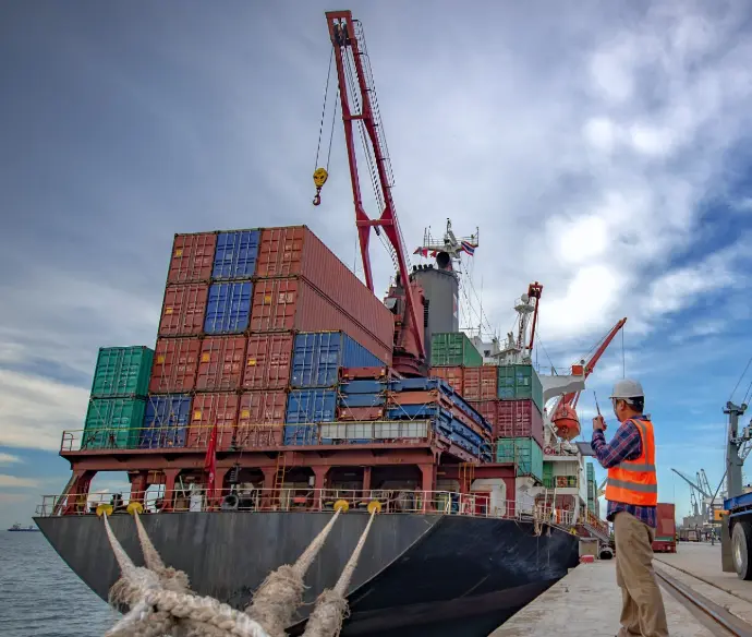 Cargo ship loading containers for international aluminum scrap export